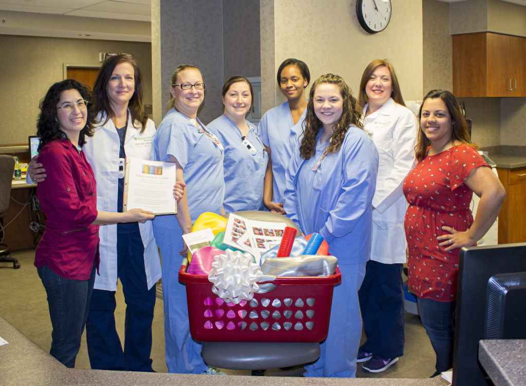 Labor and Delivery staff being presented with donated peanut ball kit