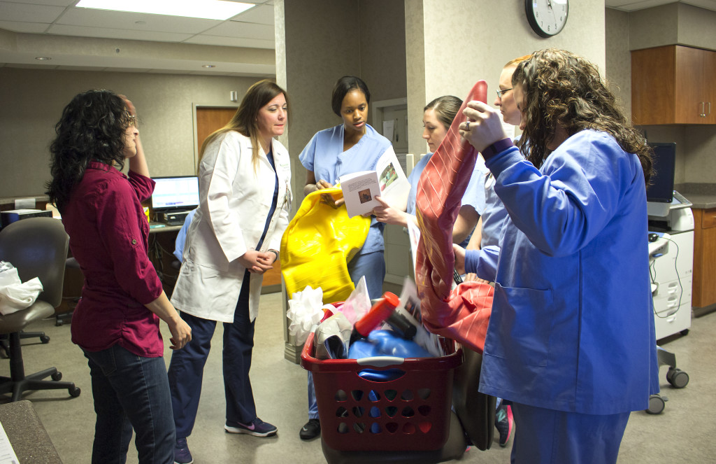 Nurses unpacking peanut ball gift basket